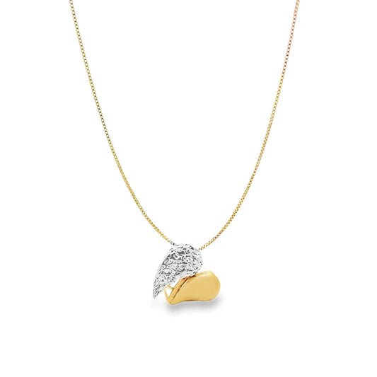 A delicate gold chain necklace hangs against a white background, featuring a two-tone pendant shaped like a textured silver wing resting next to a smooth gold heart.