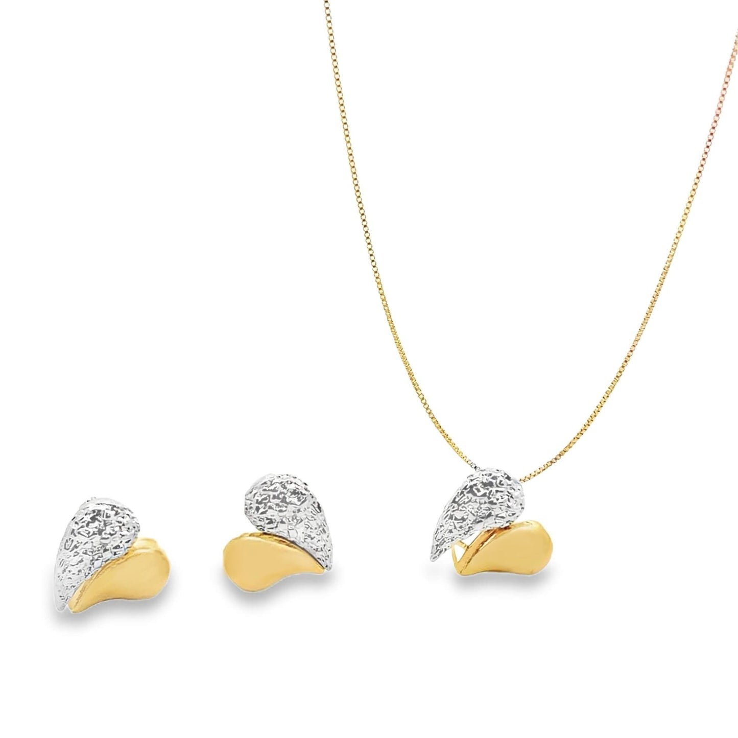 A matching two-tone gold heart jewelry set displays a delicate necklace with a pendant alongside a pair of textured white and yellow gold stud earrings.