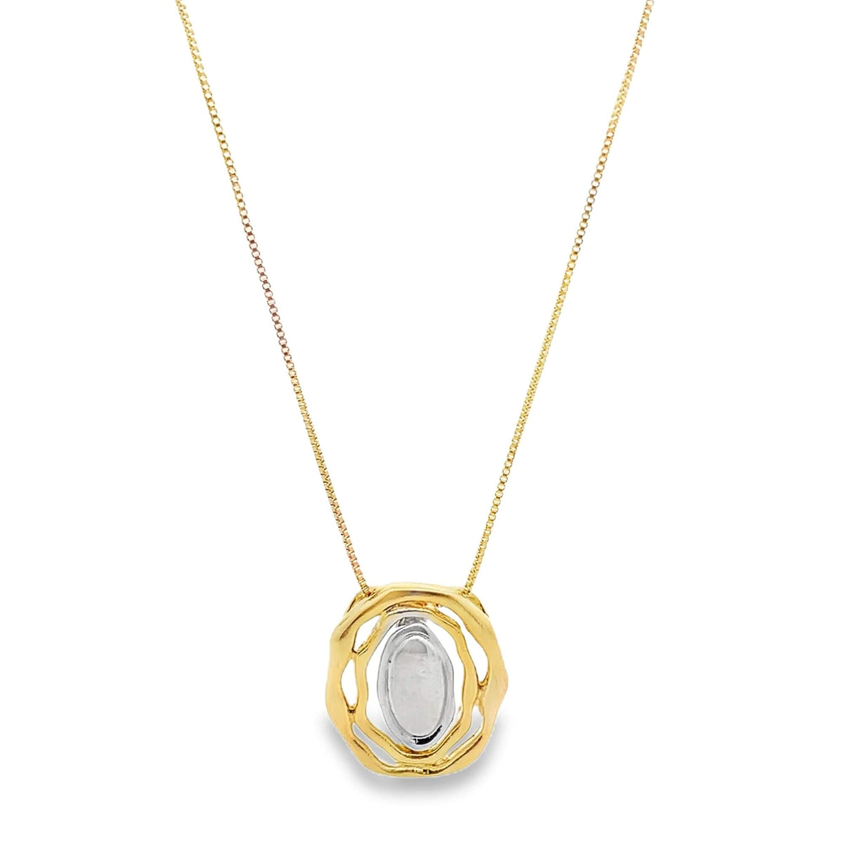 A delicate gold chain holds an abstract, textured gold pendant featuring a polished silver oval center.