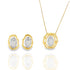 A gold and silver jewelry set displays matching earrings and a pendant necklace featuring organic, abstract frames with polished oval centers.
