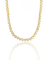 A dazzling gold tennis necklace features a continuous strand of shimmering heart-cut cubic zirconia stones against a clean white background.