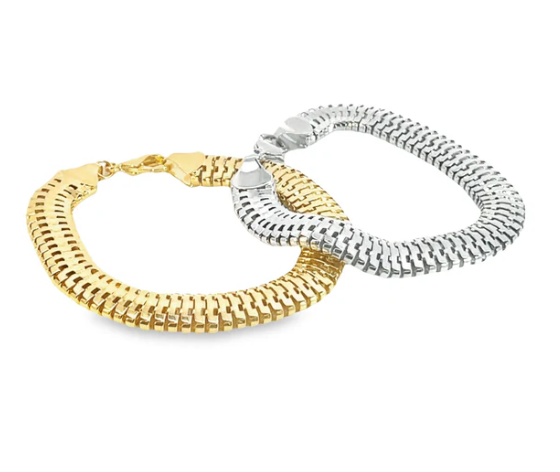 A gold bracelet and a silver bracelet featuring textured, interlocking link designs rest together on a white surface.
