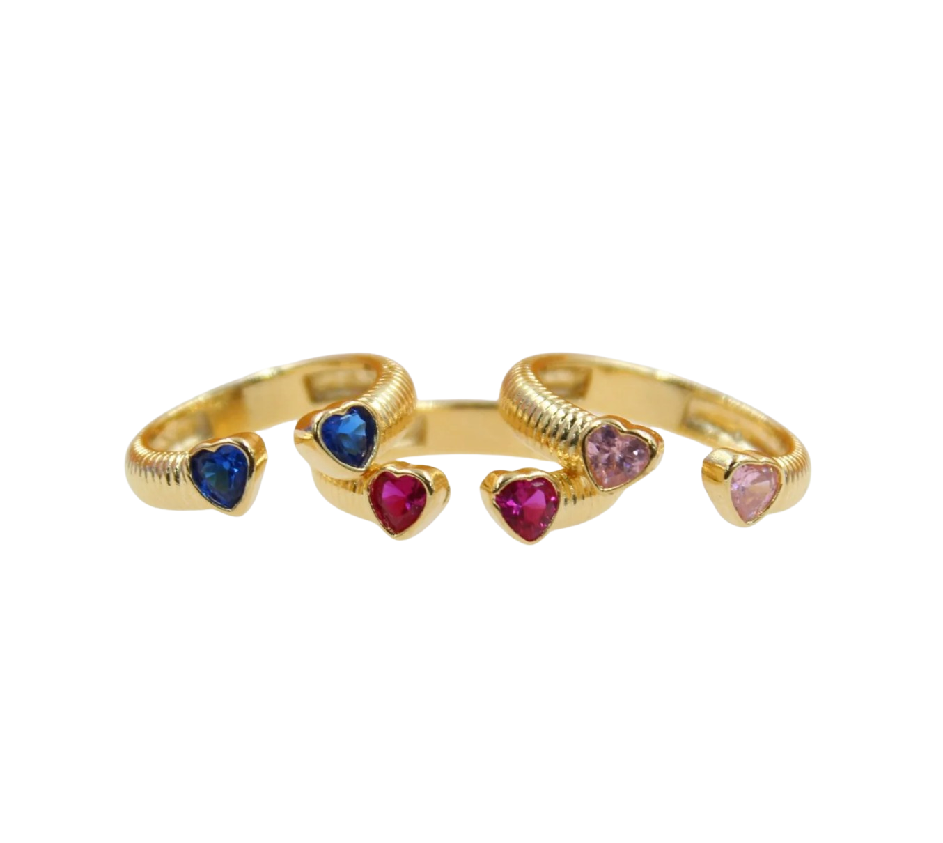 Two gold rings feature textured bands accented with colorful heart-shaped gemstones in blue, red, and pink.