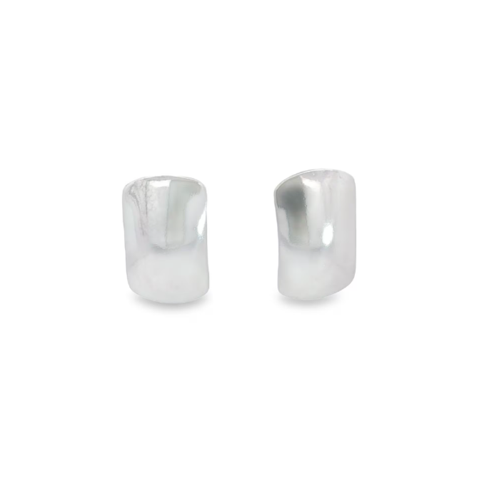 A pair of minimalist silver dome stud earrings rest against a clean white background.
