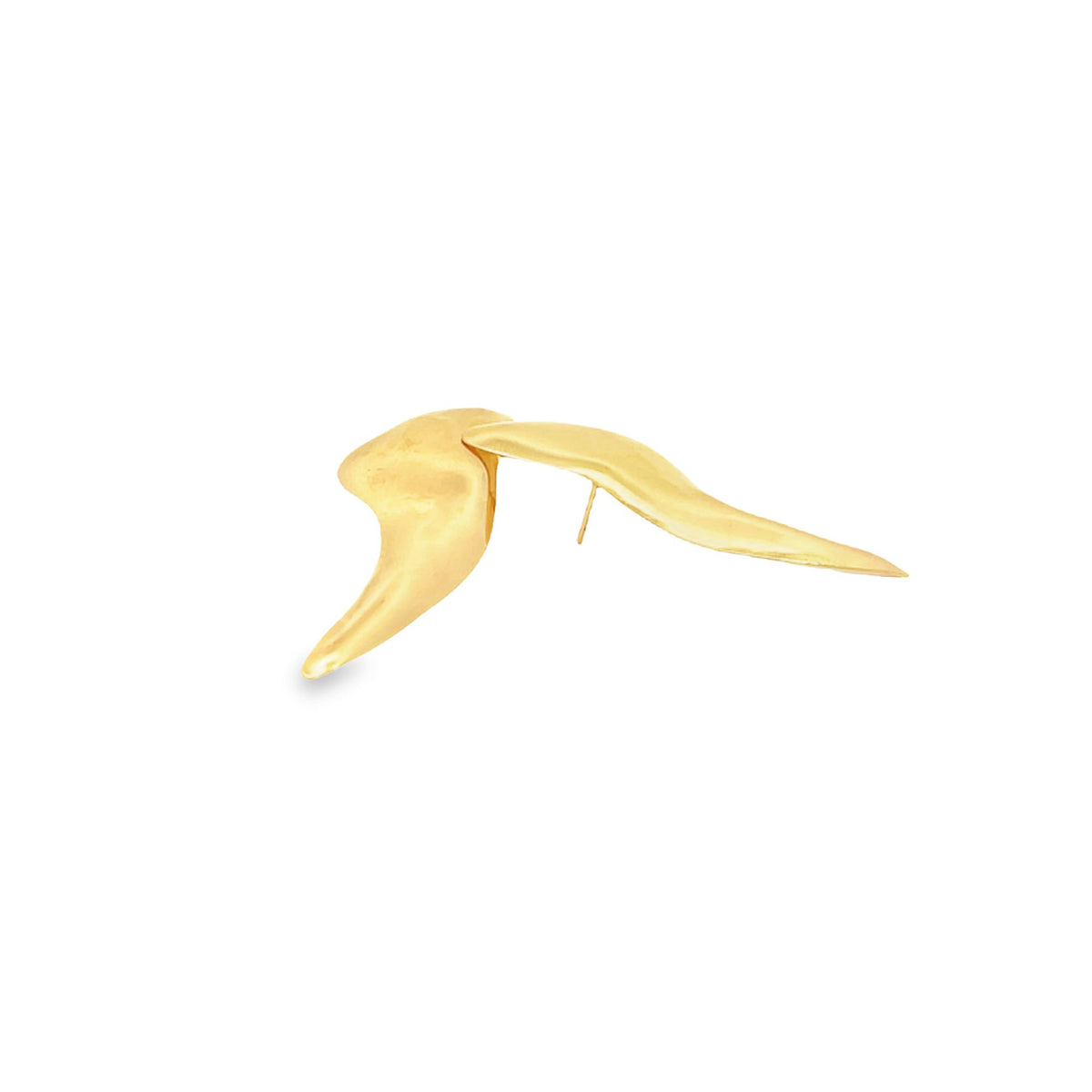A unique gold abstract sculptural earring gleams against a plain white background.