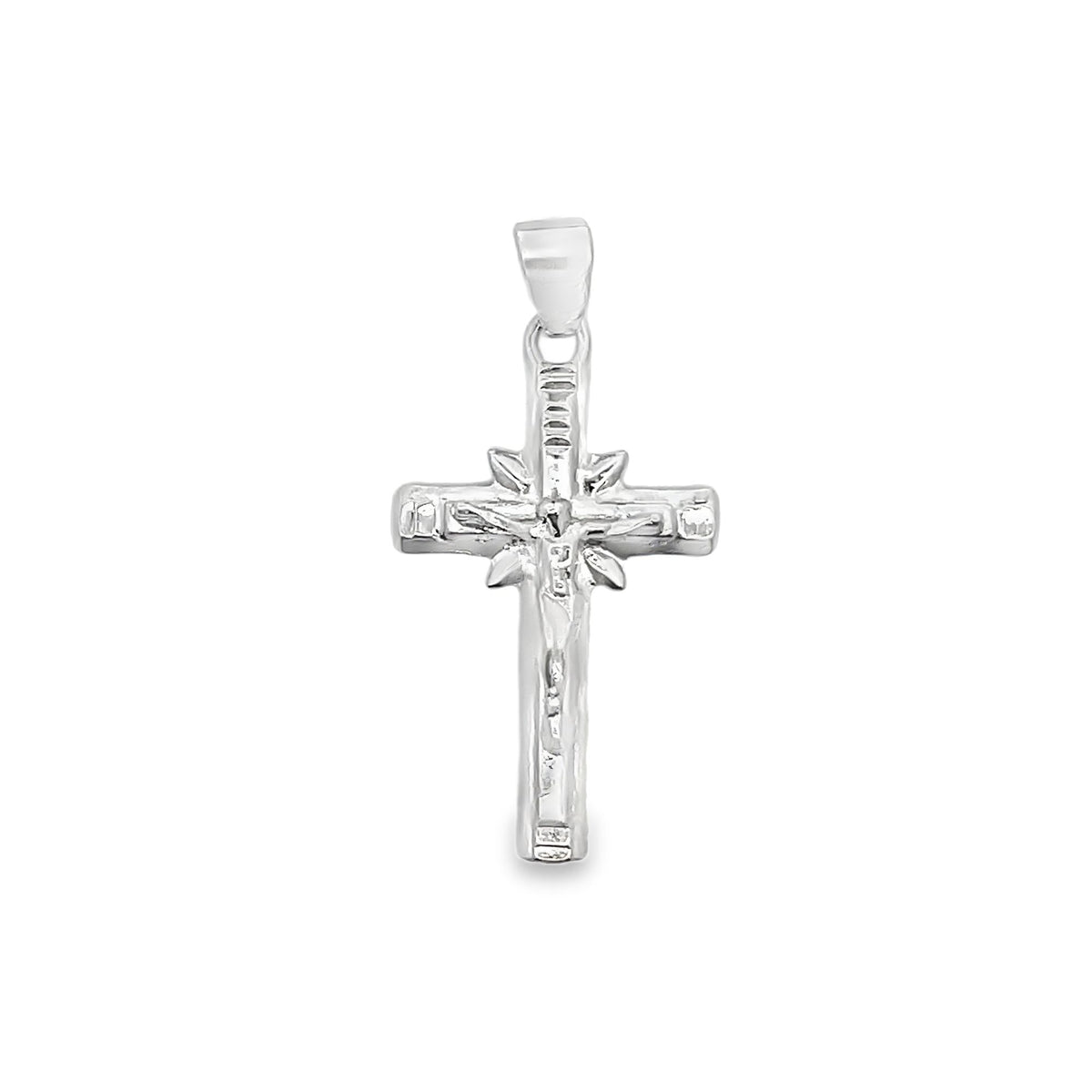 A polished silver crucifix pendant displays intricate detailing of Jesus on the cross against a clean white background.