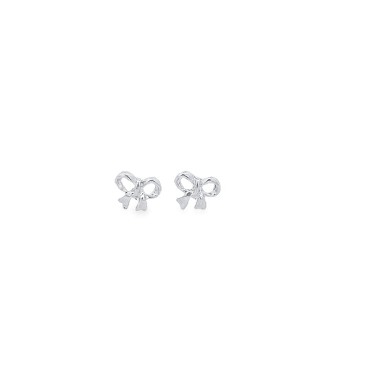 A pair of delicate silver bow stud earrings gleams against a clean white background.