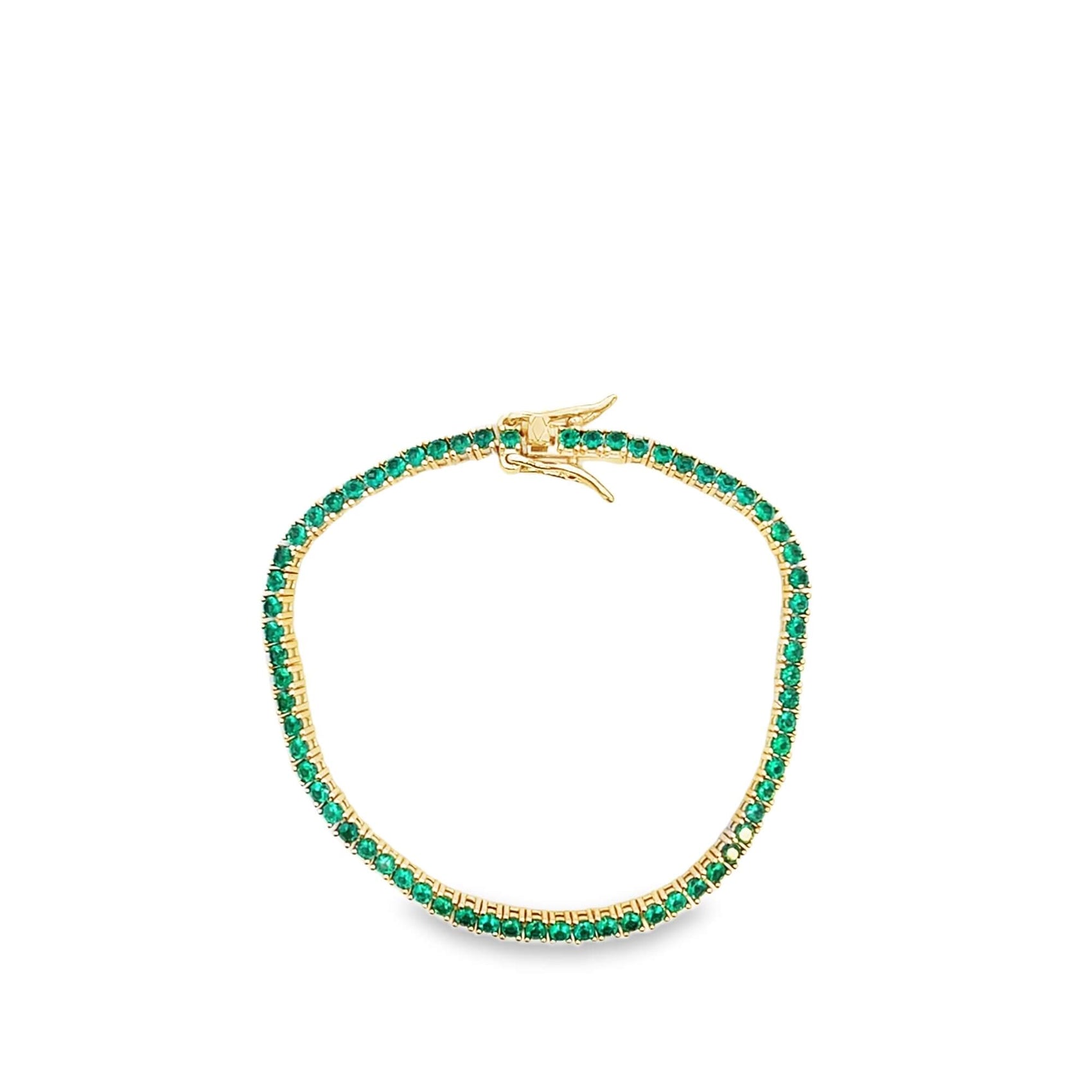 A gold tennis bracelet sparkles with vibrant green emerald stones on a clean white background.