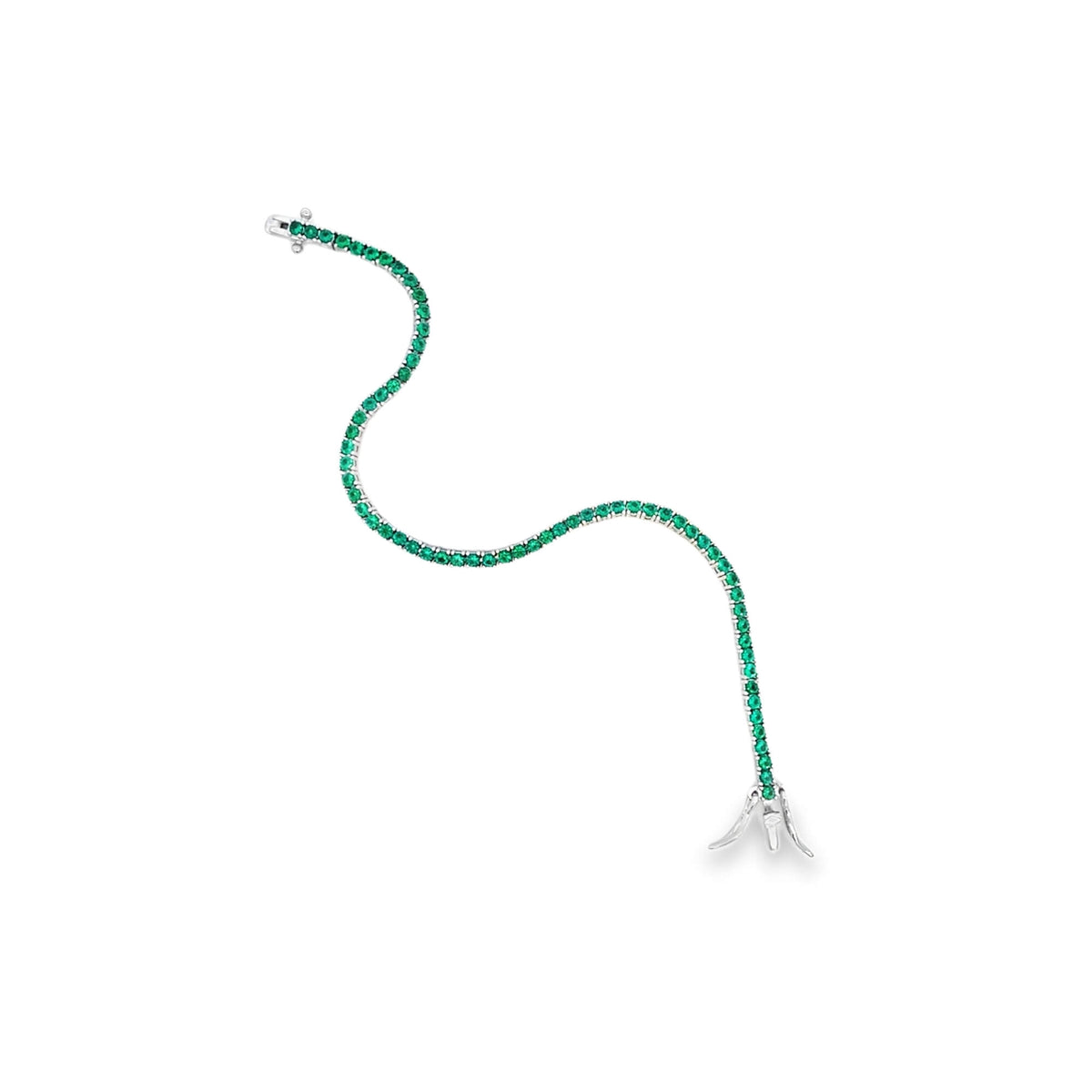 A delicate white gold tennis bracelet features a continuous line of vibrant green emerald stones, resting gracefully on a plain white background.