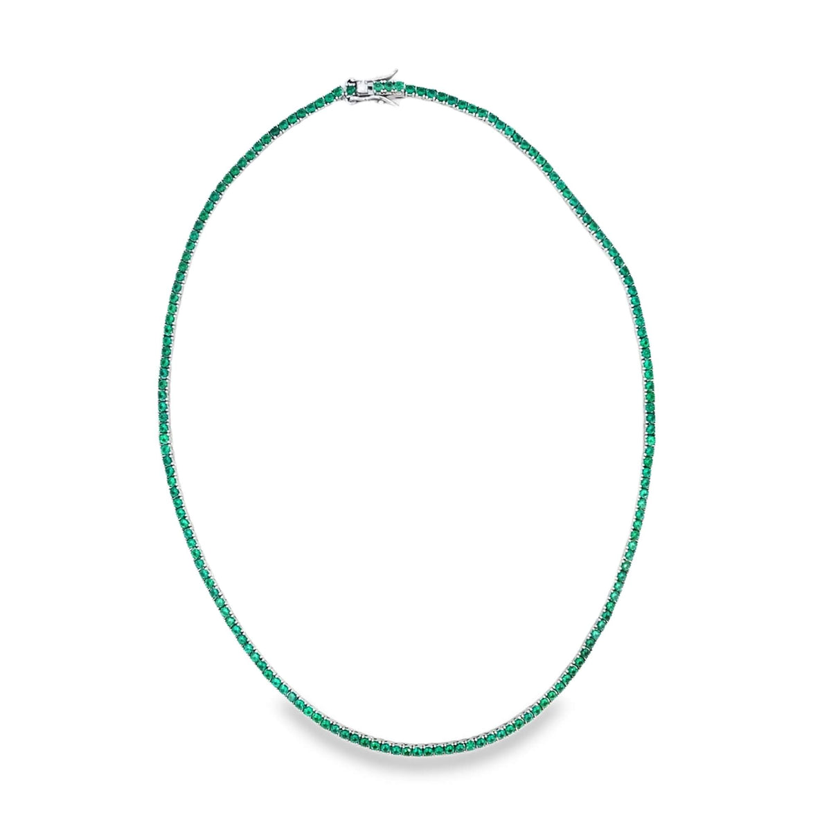 A silver tennis necklace sparkles with vibrant green emerald stones arranged in a continuous, elegant circle.