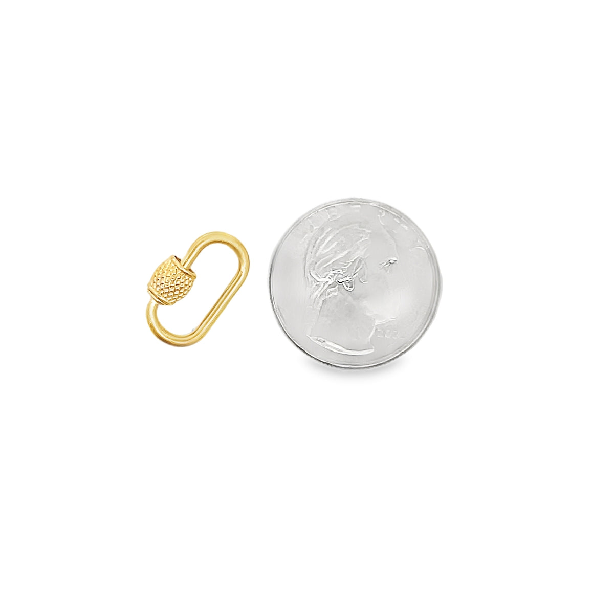 A small gold oval lock charm rests beside a US quarter coin to show its compact scale.