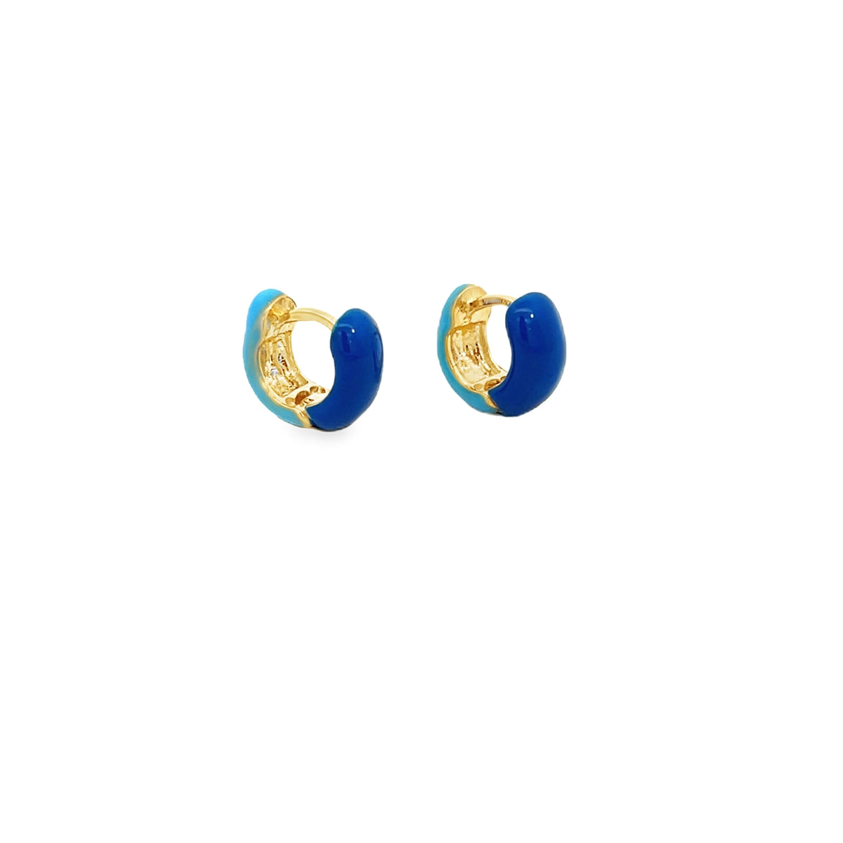 A pair of gold huggie hoop earrings features vibrant enamel detailing in shades of blue against a clean white background.