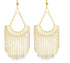 A pair of ornate gold chandelier earrings features a geometric lattice half-moon design cascading down with delicate link chain fringe.