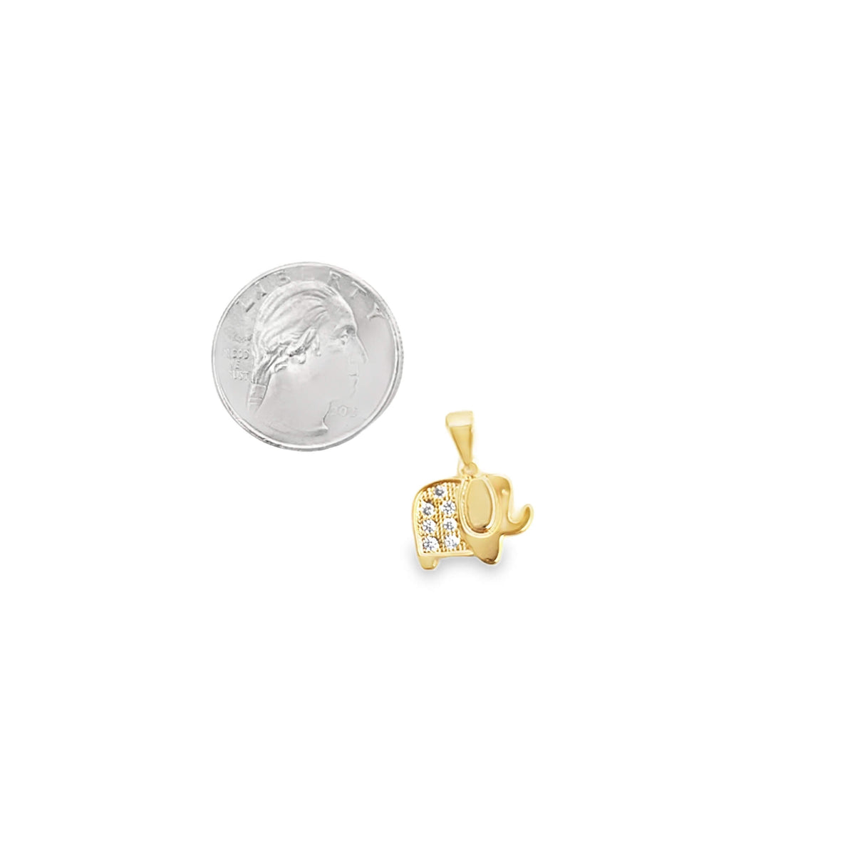 A gold elephant pendant featuring diamond accents rests beside a US quarter to display its size.
