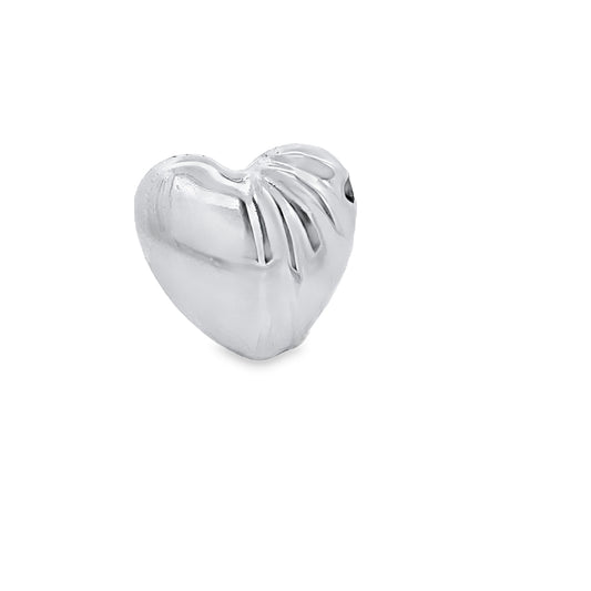 A shiny silver heart-shaped bead features ribbed detailing on one side against a clean white background.