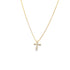 A delicate gold cross necklace sparkling with embedded diamonds hangs on a fine gold chain against a white background.