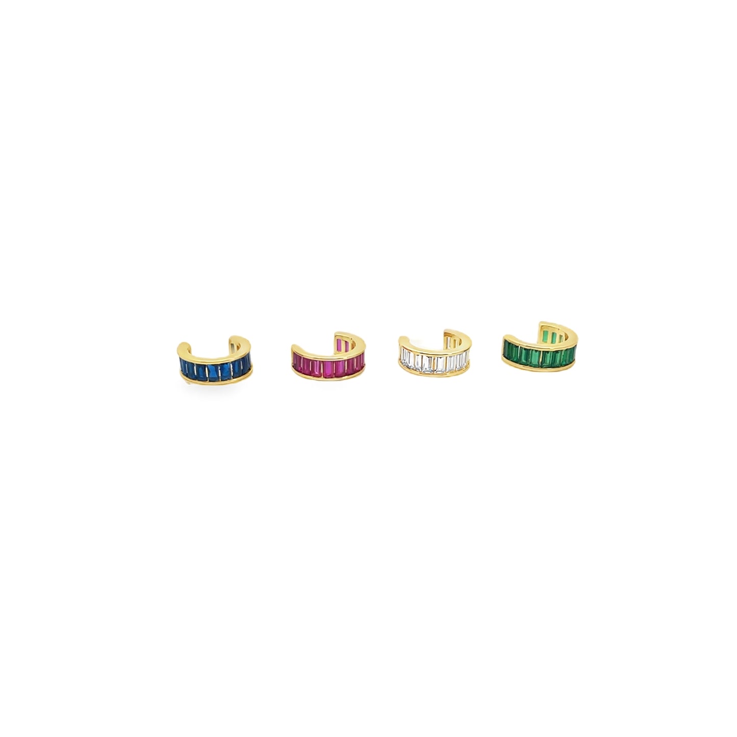 Four gold ear cuffs set with colorful baguette-cut stones in blue, pink, white, and green display in a row on a white background.