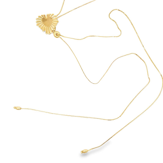 A delicate gold pendant necklace features a textured heart charm on a slender chain against a white background.