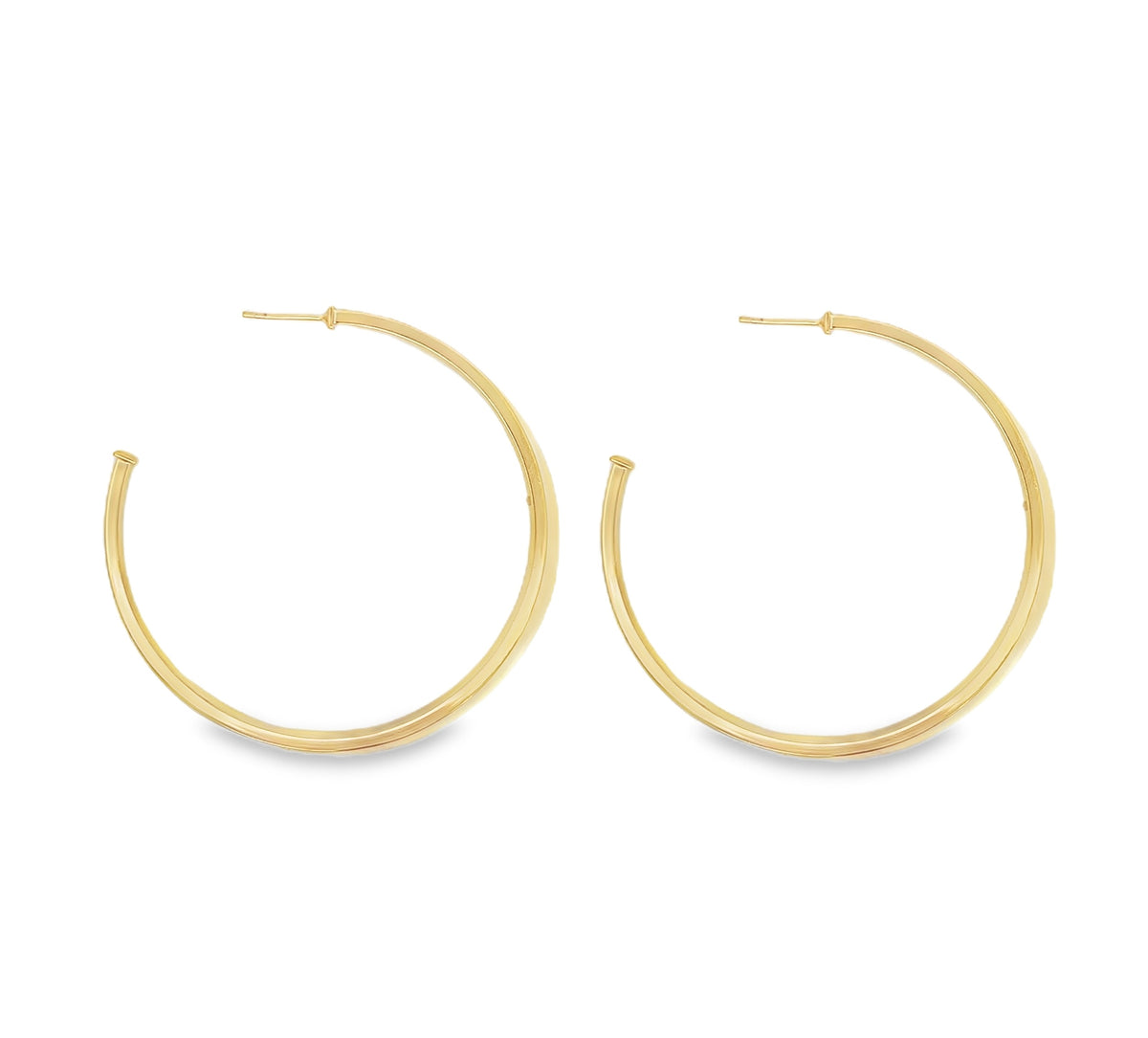 A pair of elegant gold hoop earrings gleams against a clean white background.
