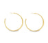 A pair of elegant gold hoop earrings gleams against a clean white background.