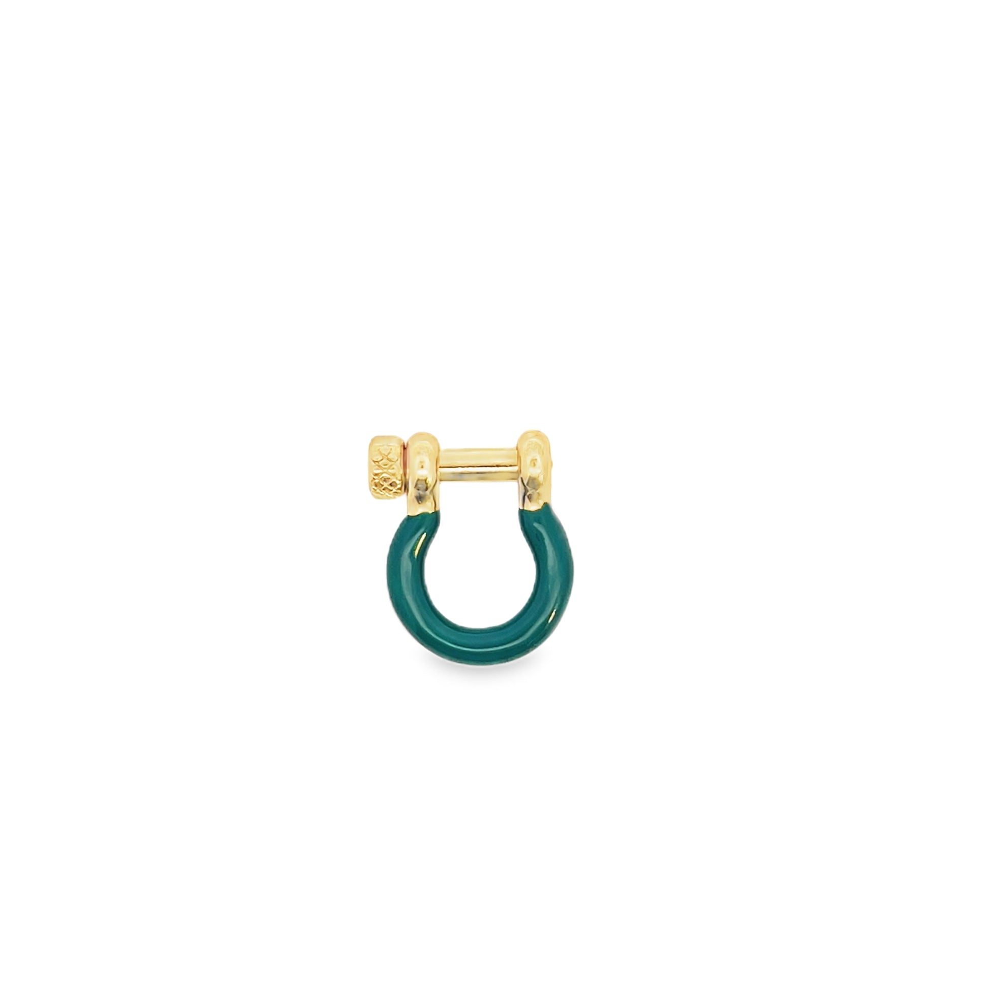A gold shackle earring featuring a vibrant green enamel loop rests on a plain white background.