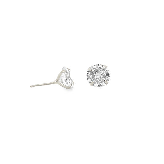 A pair of sparkling solitaire diamond stud earrings rests on a clean white background, showcasing their brilliant round-cut gemstones and classic settings.