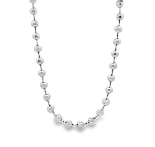 A gleaming silver ball chain necklace hangs in a graceful curve against a clean white background.
