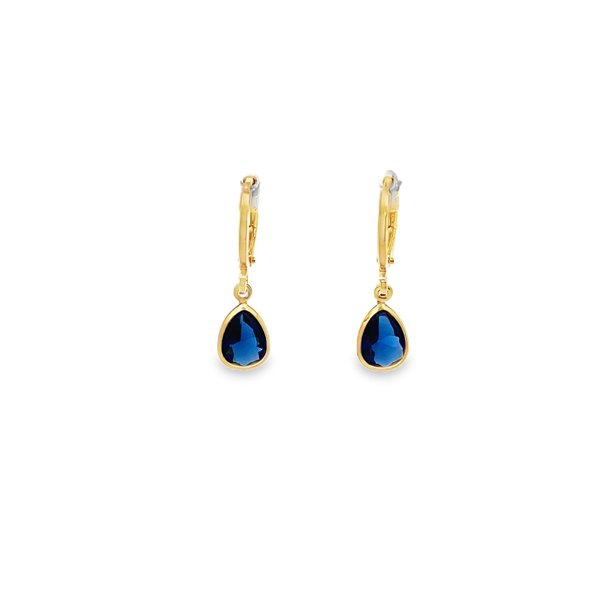 A pair of gold teardrop earrings dangling with rich blue gemstone pendants are displayed against a clean white background.