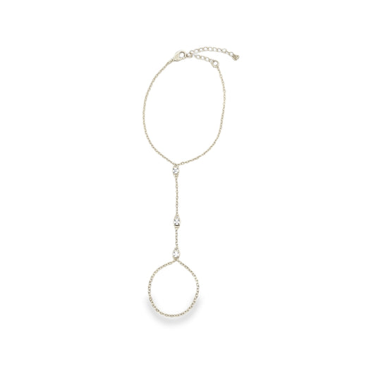 A delicate silver slave bracelet features sparkling crystal accents along the chain and finger ring against a clean white background.