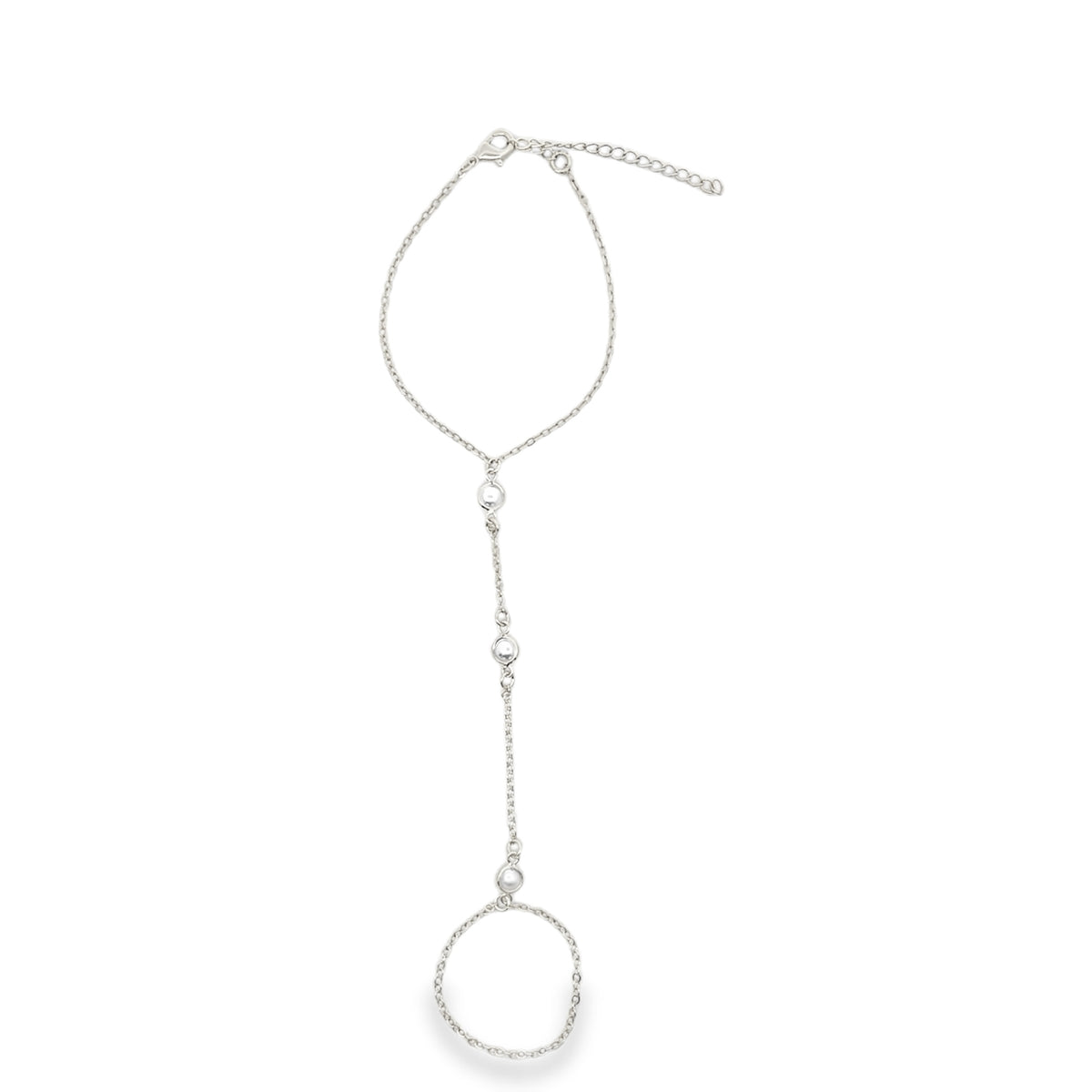 A delicate silver finger bracelet features a thin chain connecting a wrist loop to an integrated ring adorned with small beads.