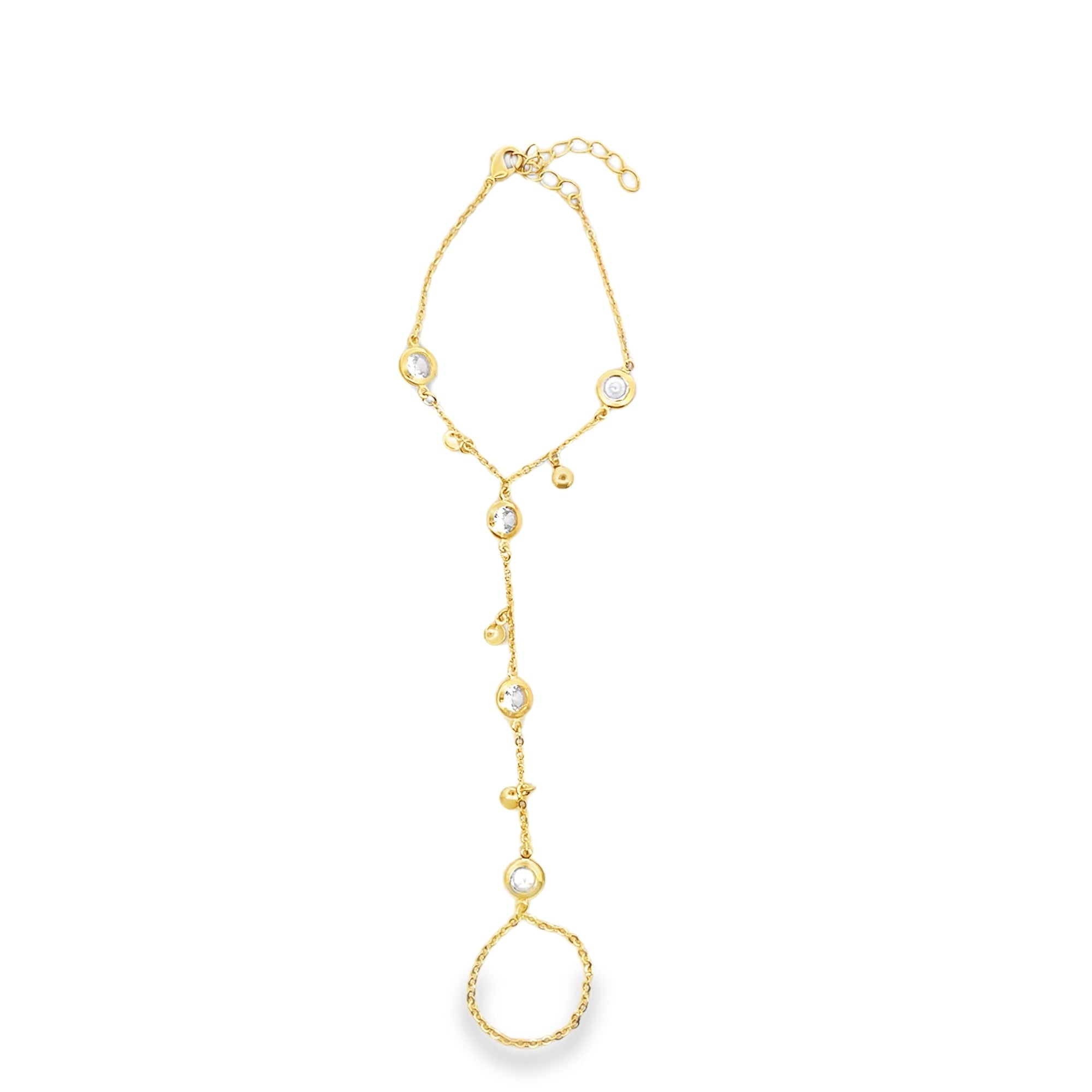 A delicate gold slave bracelet features bezel-set crystal stones and dangles against a clean white background.