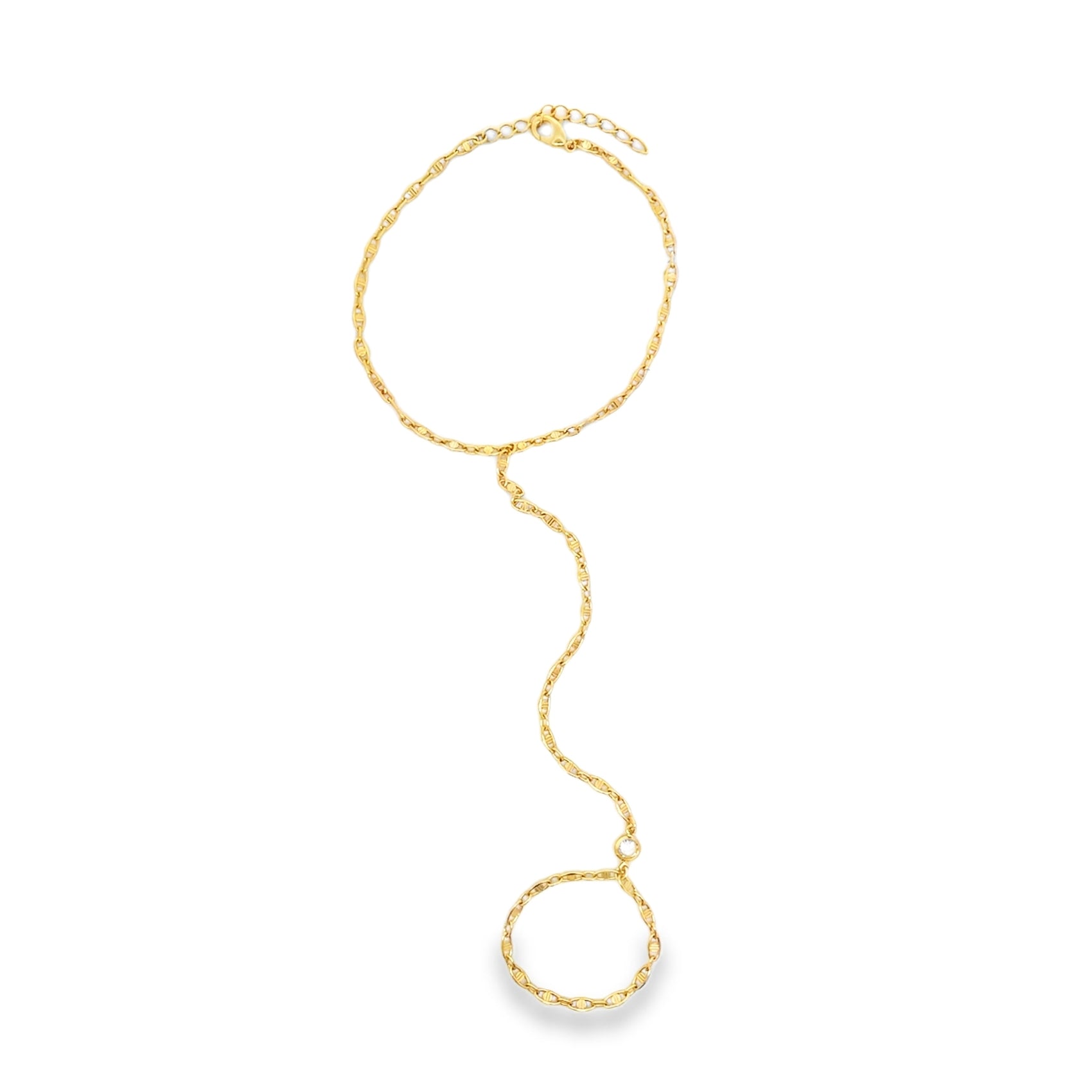A delicate gold hand chain bracelet sparkles against a white background, featuring a slender mariner link chain connecting a wrist bracelet to an adjustable finger ring.