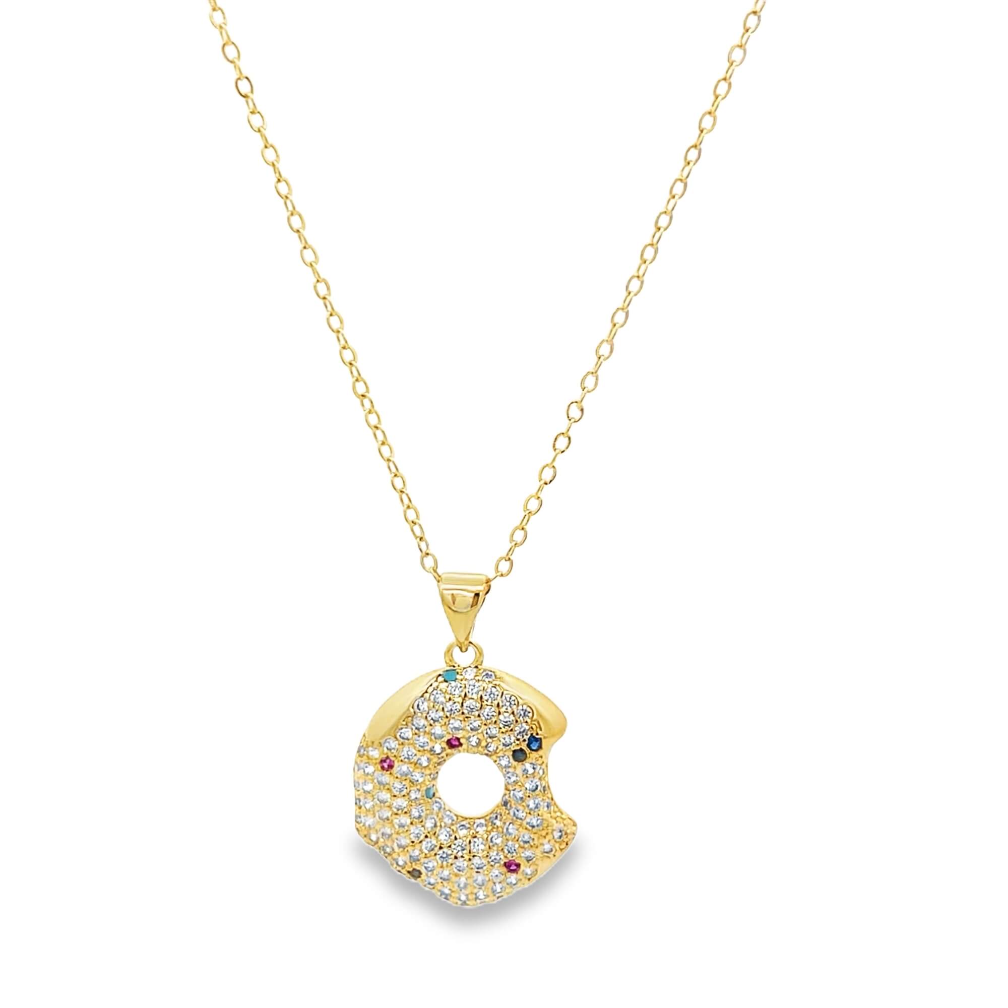 Modern gold open circle pendant necklace featuring pavé cubic zirconia stones. A minimalist yet eye-catching necklace perfect for layering or everyday wear.