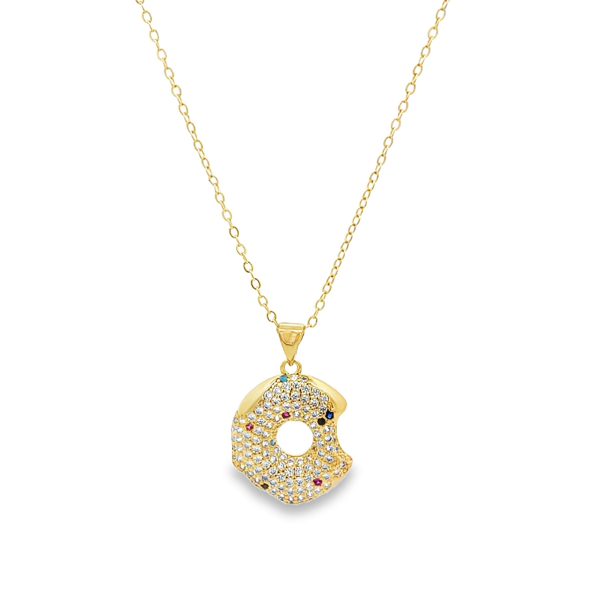 Modern gold open circle pendant necklace featuring pavé cubic zirconia stones. A minimalist yet eye-catching necklace perfect for layering or everyday wear.