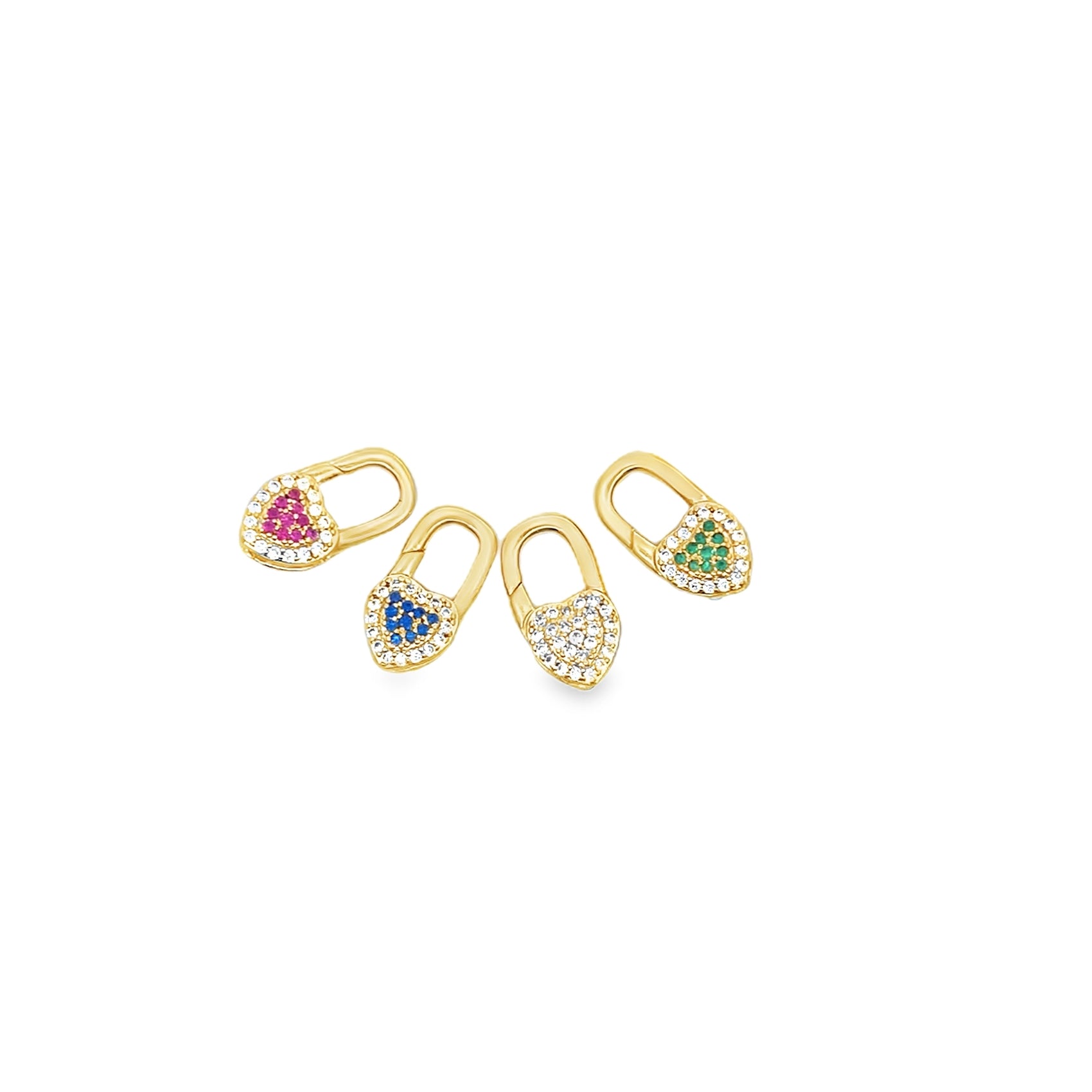 Four gold padlock charms featuring pave diamonds and colorful gemstone hearts in pink, blue, white, and green rest against a white background.