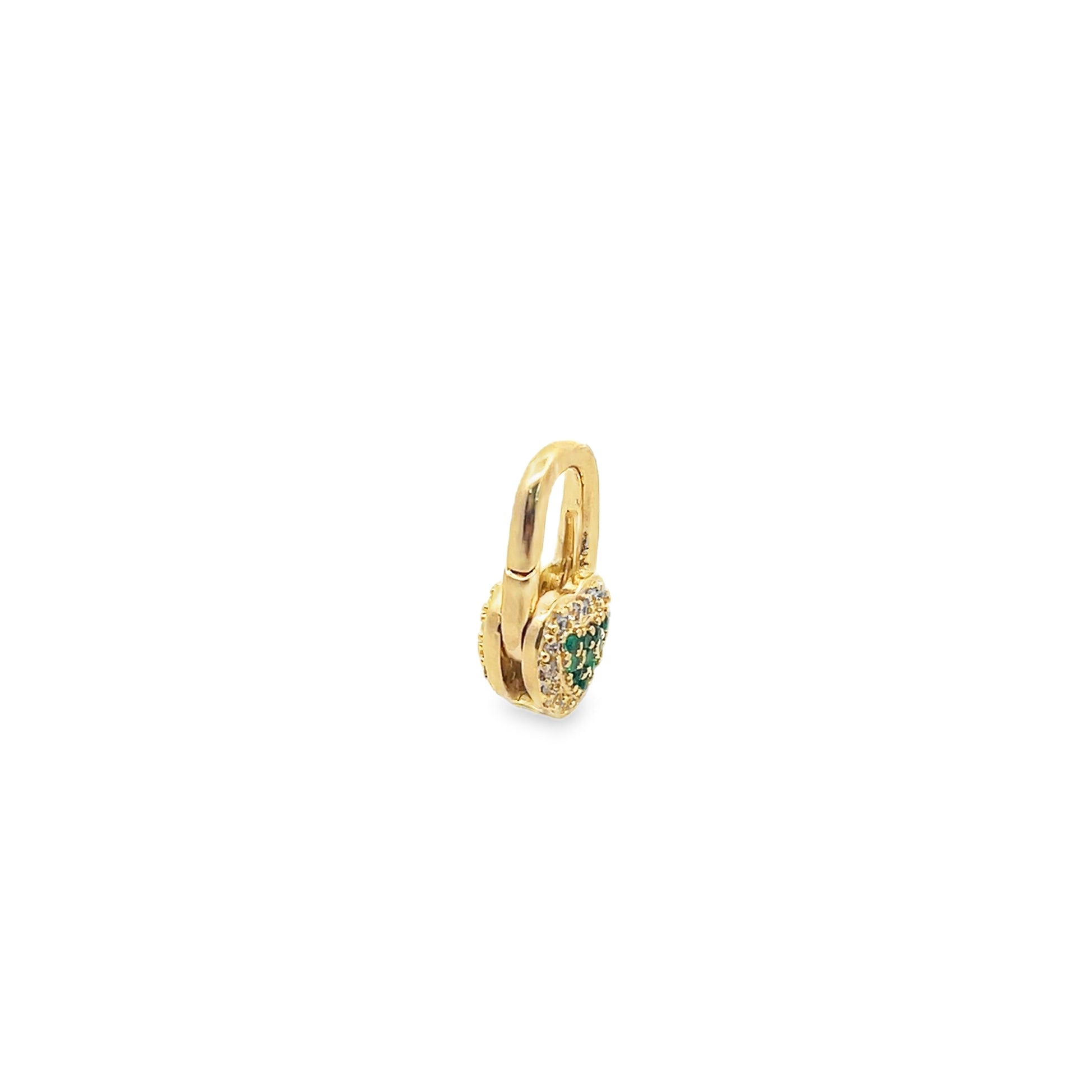 A gold padlock charm featuring pave diamonds and emerald crystals rests against a white background.