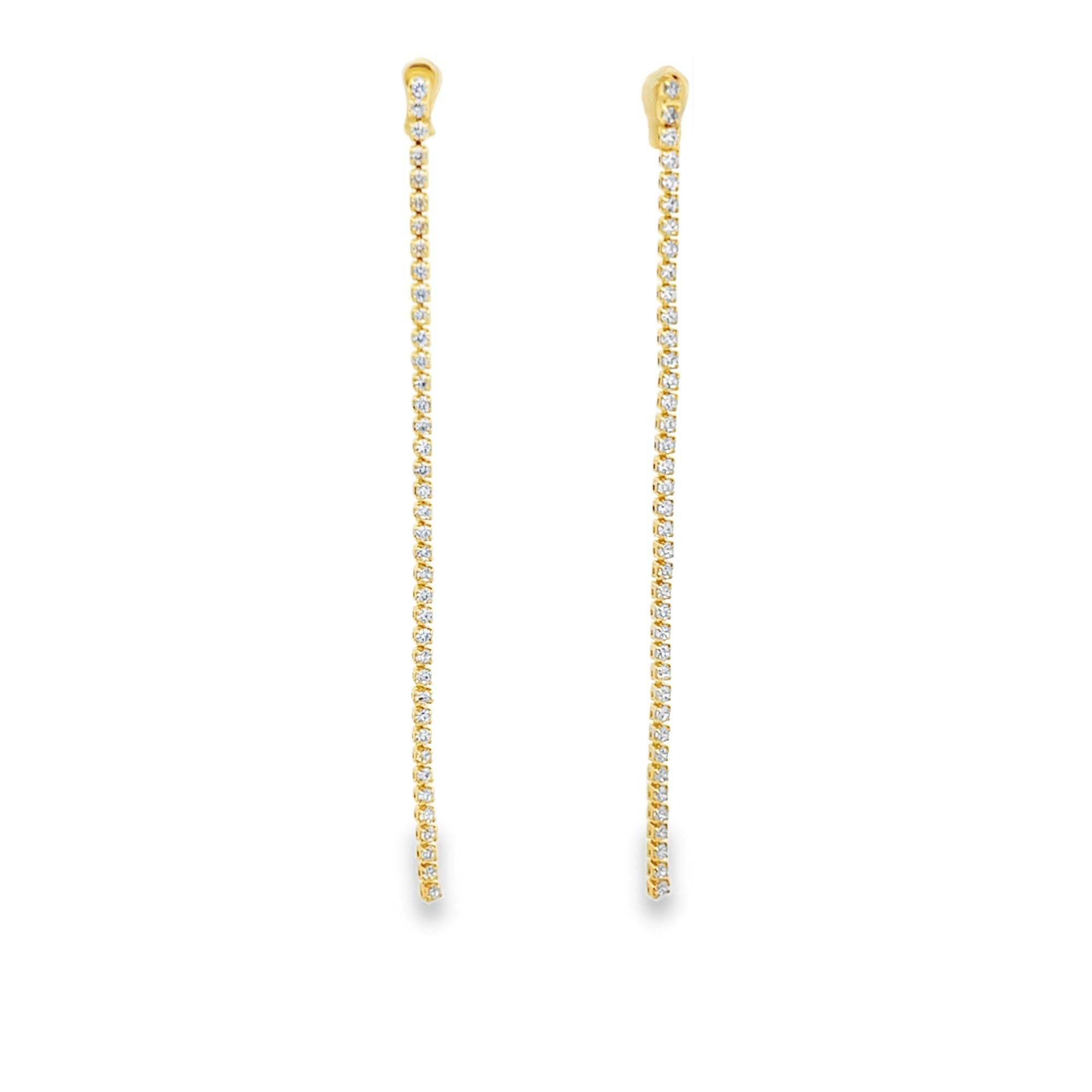 Elegant long CZ tennis drop earrings in gold or silver plating. Sparkling cubic zirconia dangle earrings perfect for bridal and formal wear.