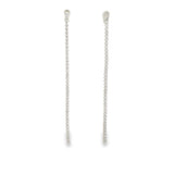 Elegant long CZ tennis drop earrings in gold or silver plating. Sparkling cubic zirconia dangle earrings perfect for bridal and formal wear.