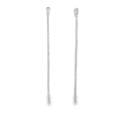 Elegant long CZ tennis drop earrings in gold or silver plating. Sparkling cubic zirconia dangle earrings perfect for bridal and formal wear.