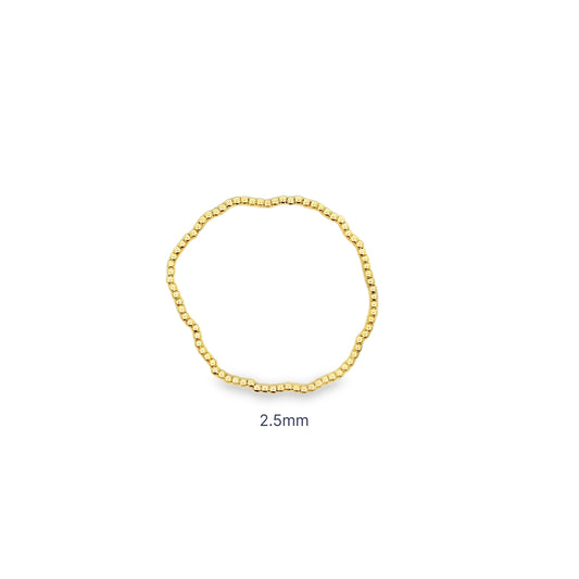 Heavy gold beaded stretch bracelet with thick polished ball beads. Chunky, statement design with substantial weight and luxury shine.