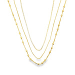 Elegant triple layer necklace featuring baguette, box and beaded chains. Minimalist layered jewelry available in gold or silver. Perfect for everyday wear.