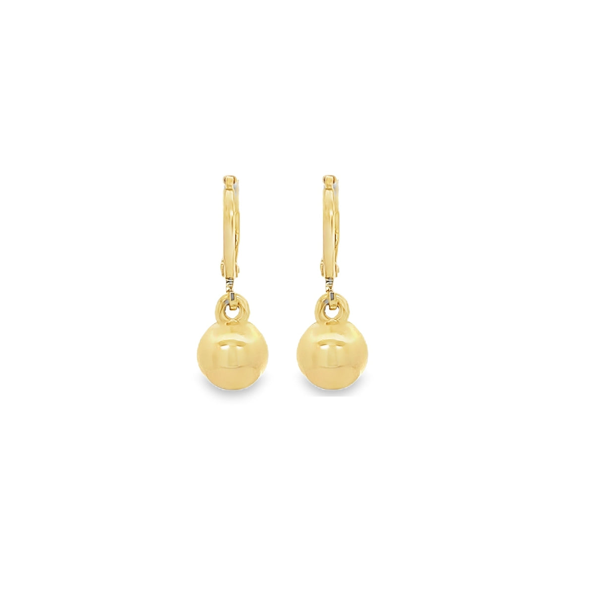 A pair of polished gold drop earrings featuring smooth ball pendants dangle gracefully against a clean white background.