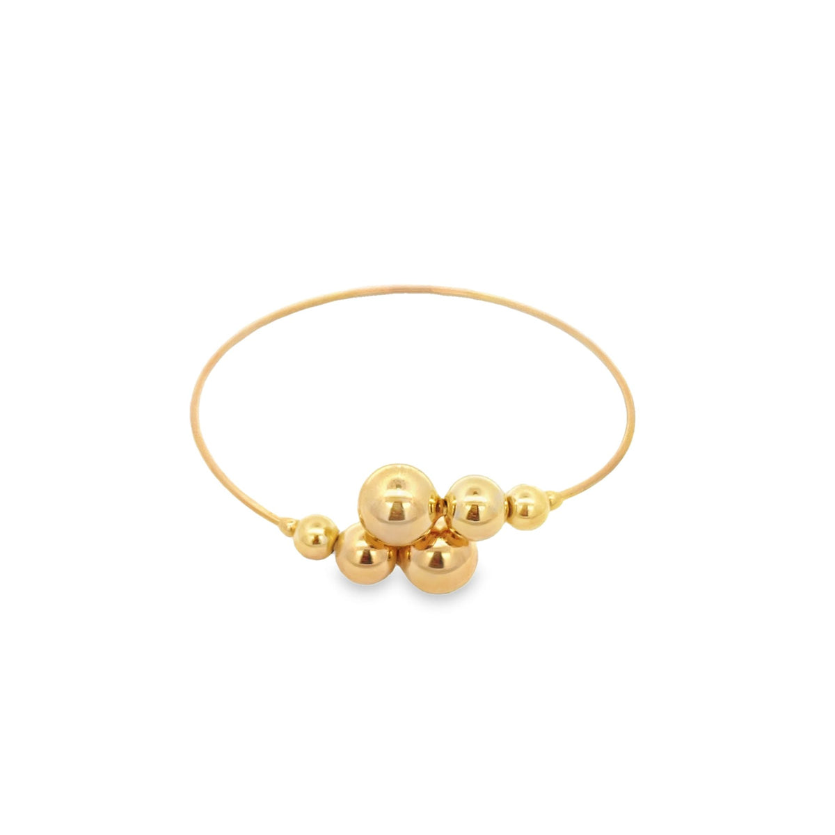 A delicate gold bangle bracelet features a cluster of shiny spherical beads in the center against a clean white background.