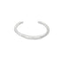 A sleek, minimalist silver cuff ring rests against a plain white background.