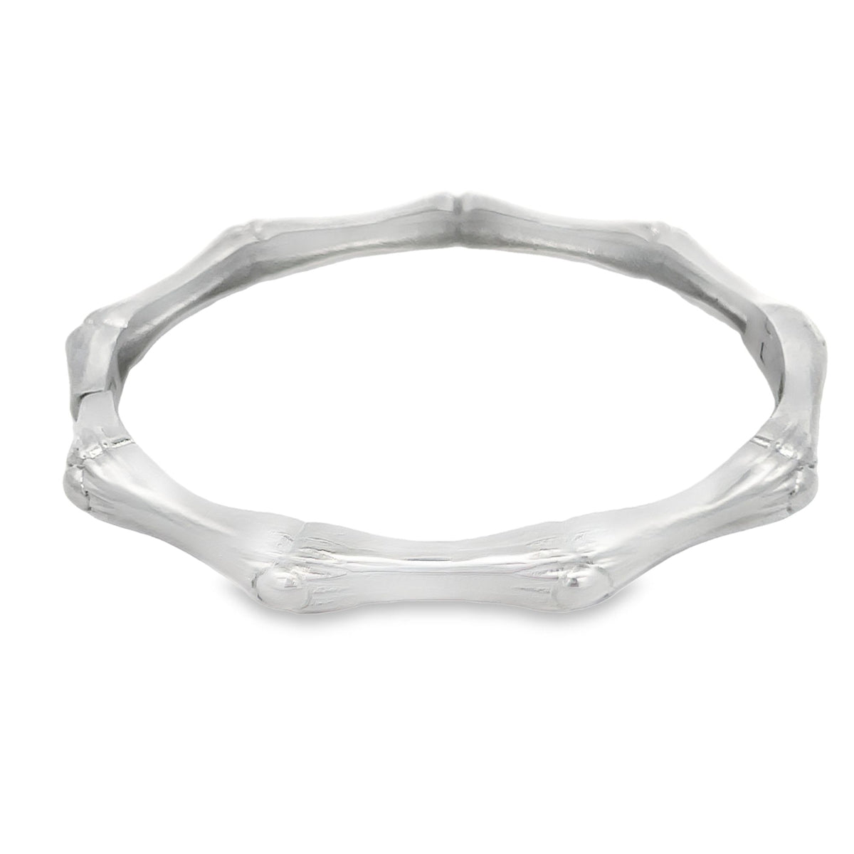 A polished sterling silver bangle bracelet features a textured bamboo-style design.