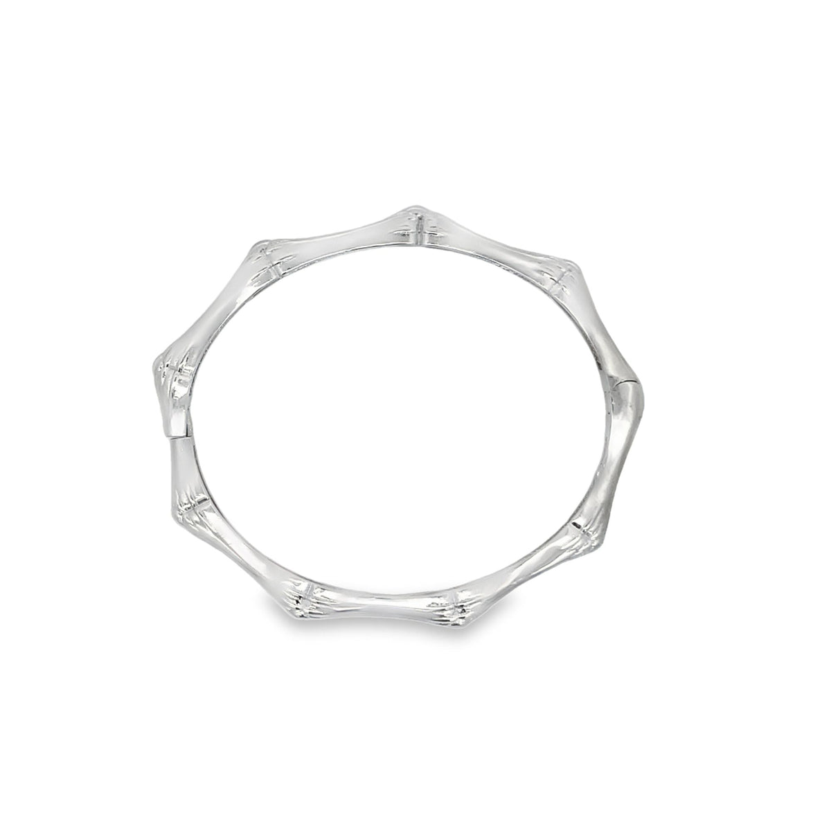 A sleek silver bangle bracelet showcases a distinctive bamboo-joint design against a clean white background.