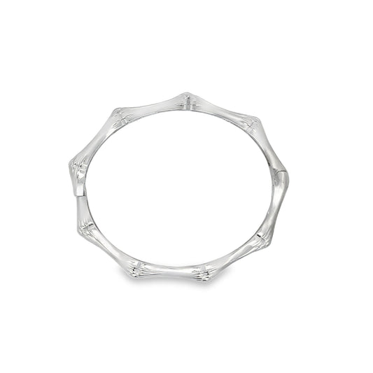 A sleek silver bangle bracelet showcases a distinctive bamboo-joint design against a clean white background.