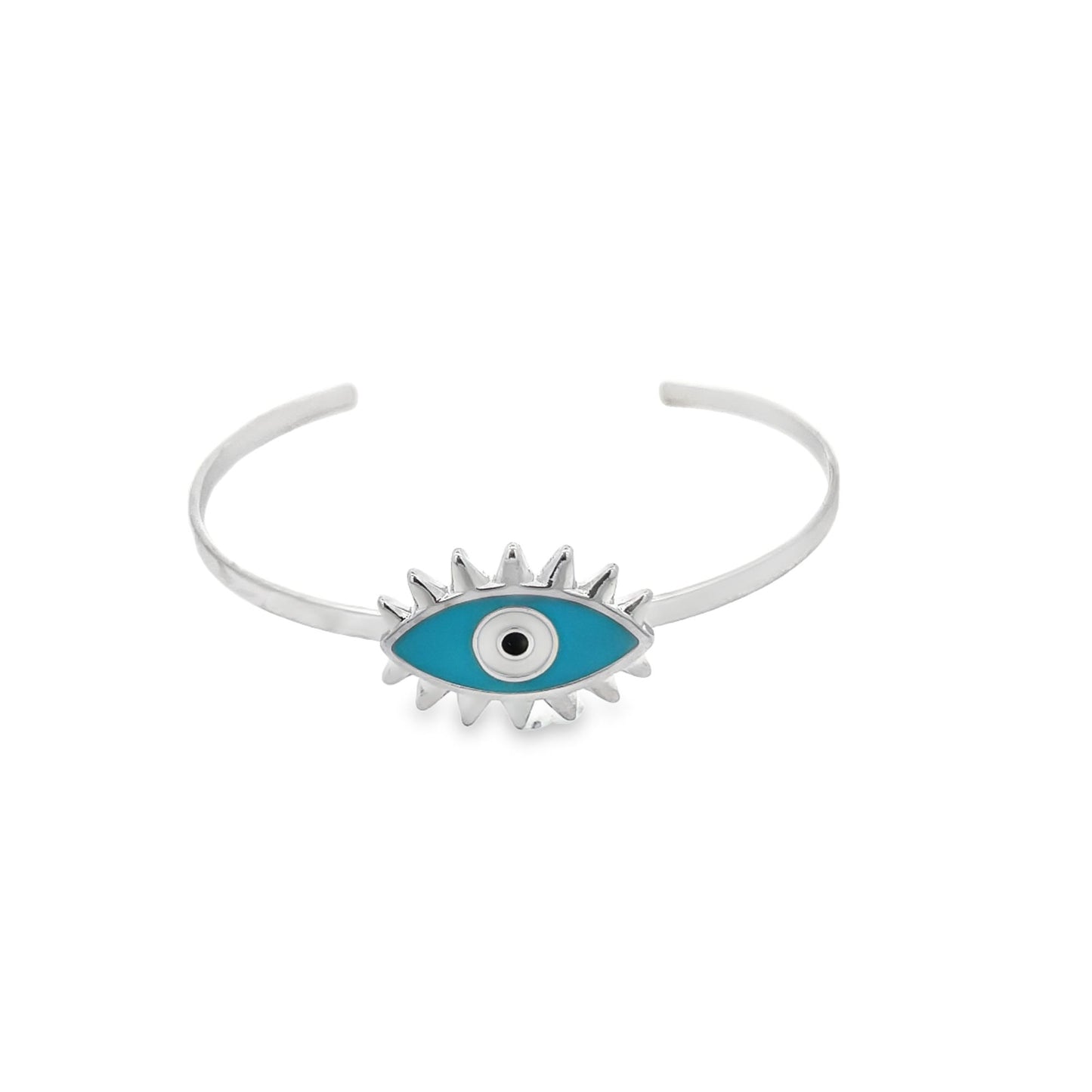 A silver cuff bracelet features a vibrant blue enamel evil eye charm with sunburst details against a plain white background.