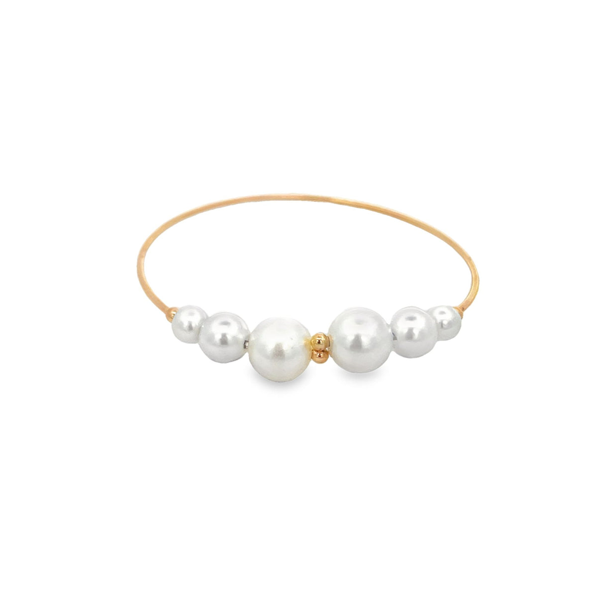 A delicate gold wire ring features a symmetrical arrangement of graduated white pearls.