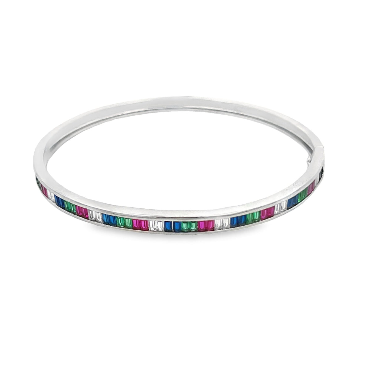 A sleek silver bangle bracelet showcases a vibrant channel-set array of multicolored baguette gemstones.
